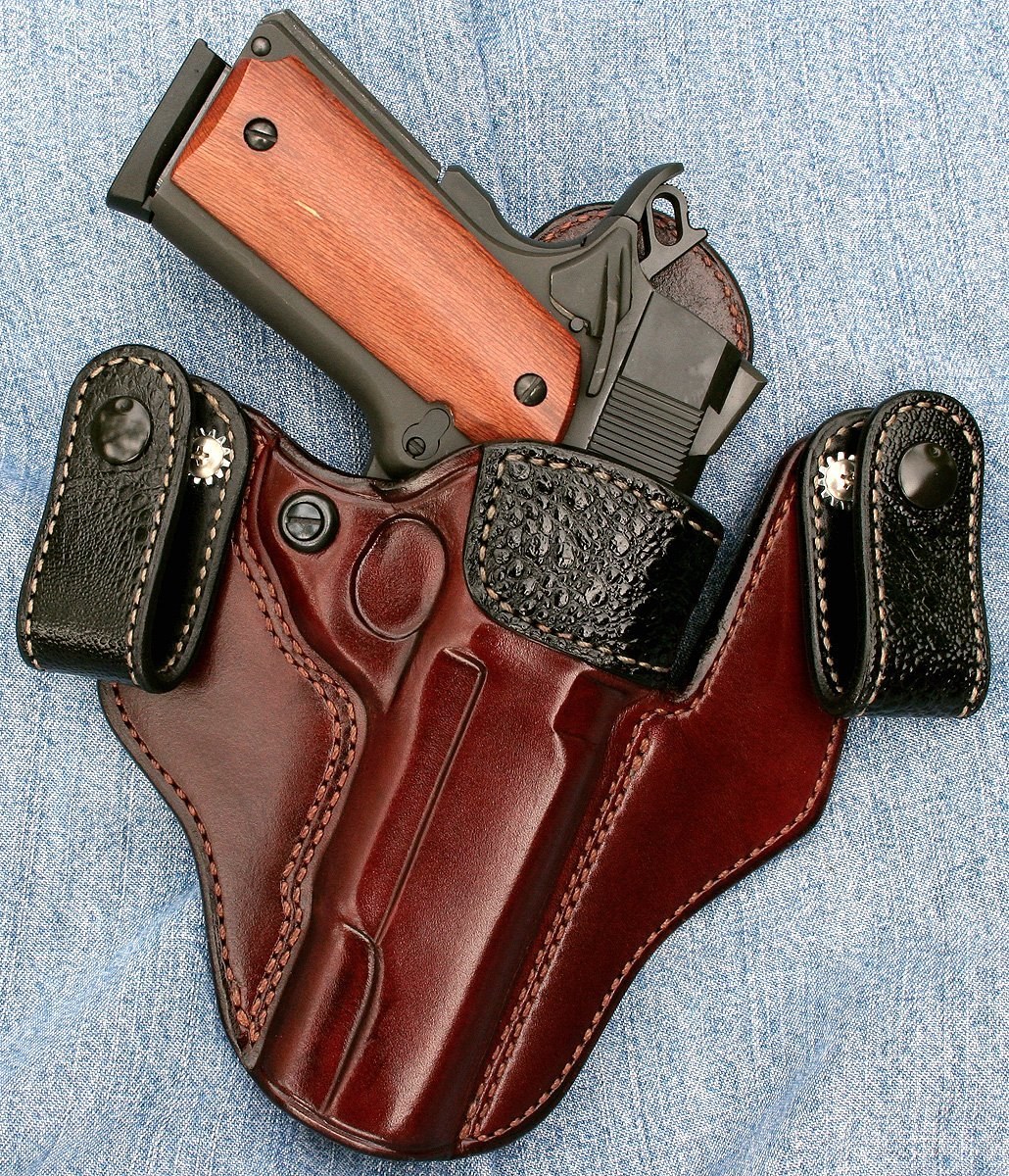 handgun in leather holster