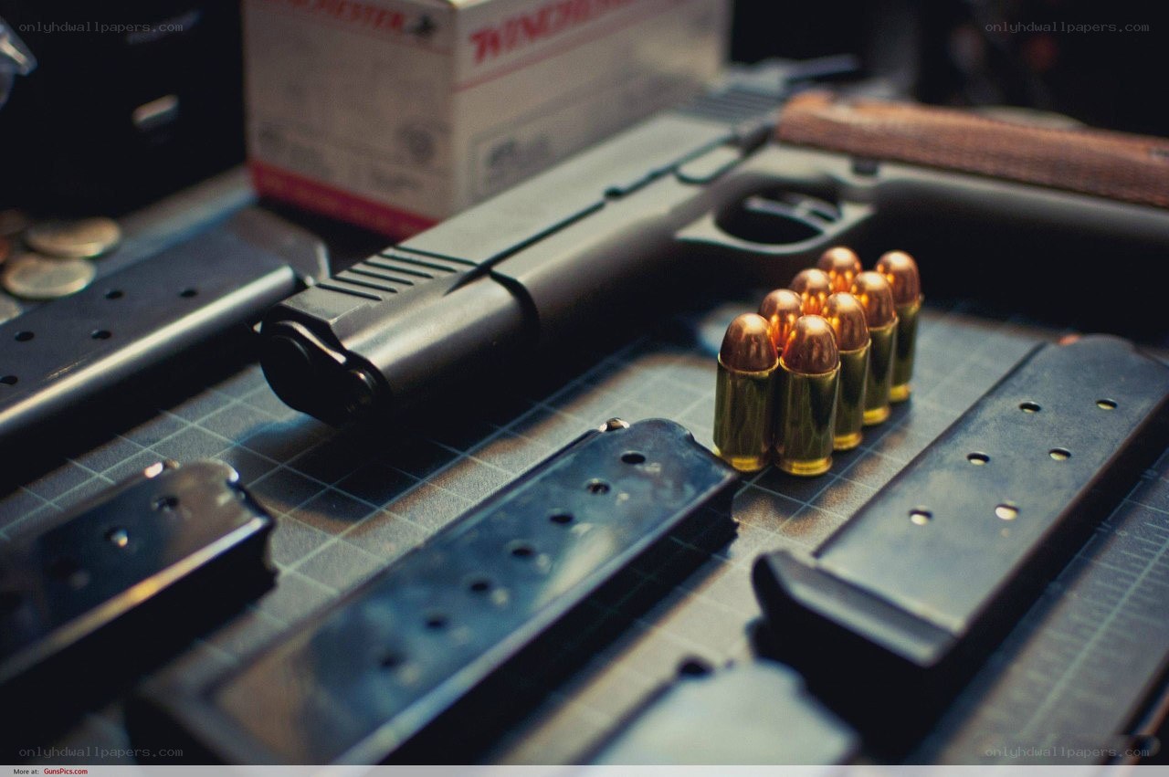 Handgun with ammunition and magazines