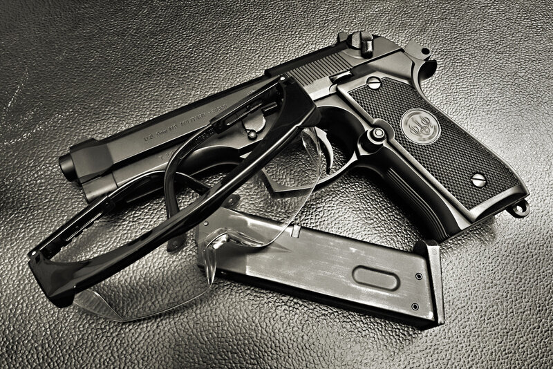 Handgun with magazine and glasses