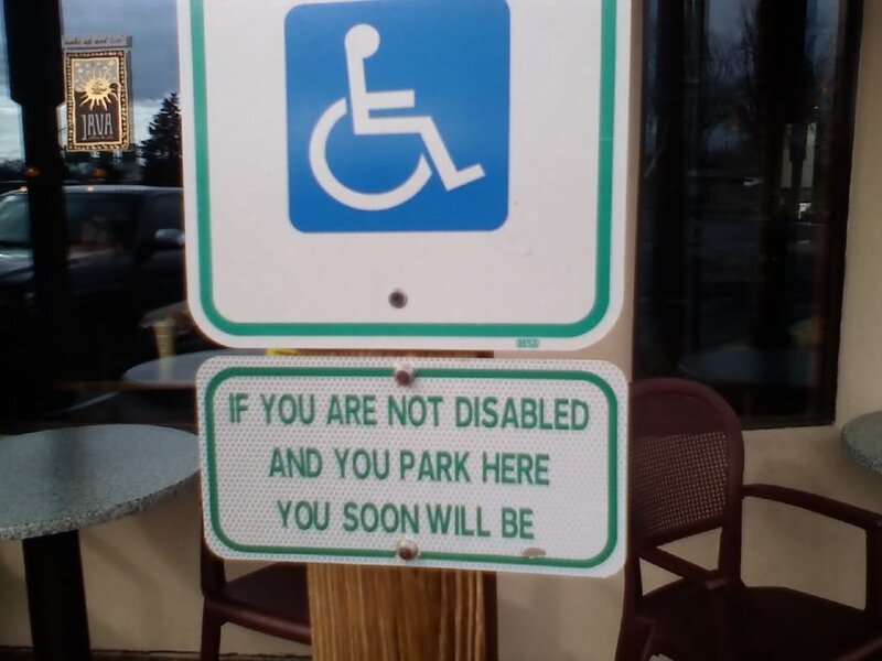 handicap parking sign with warning