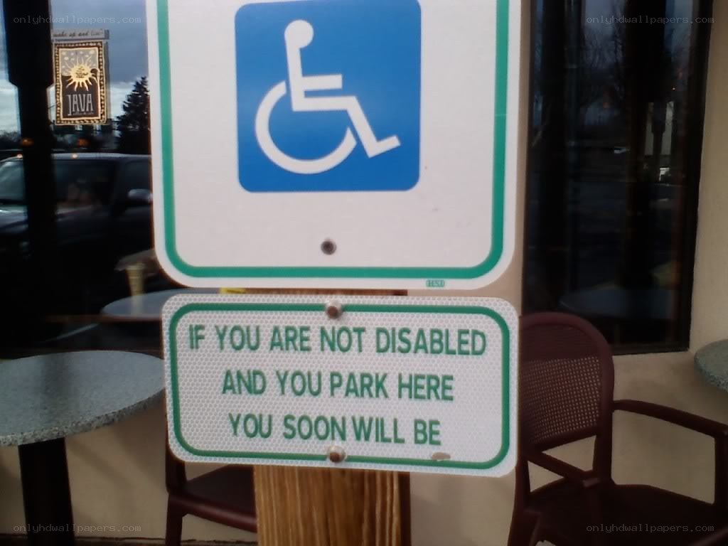 handicap parking sign with warning