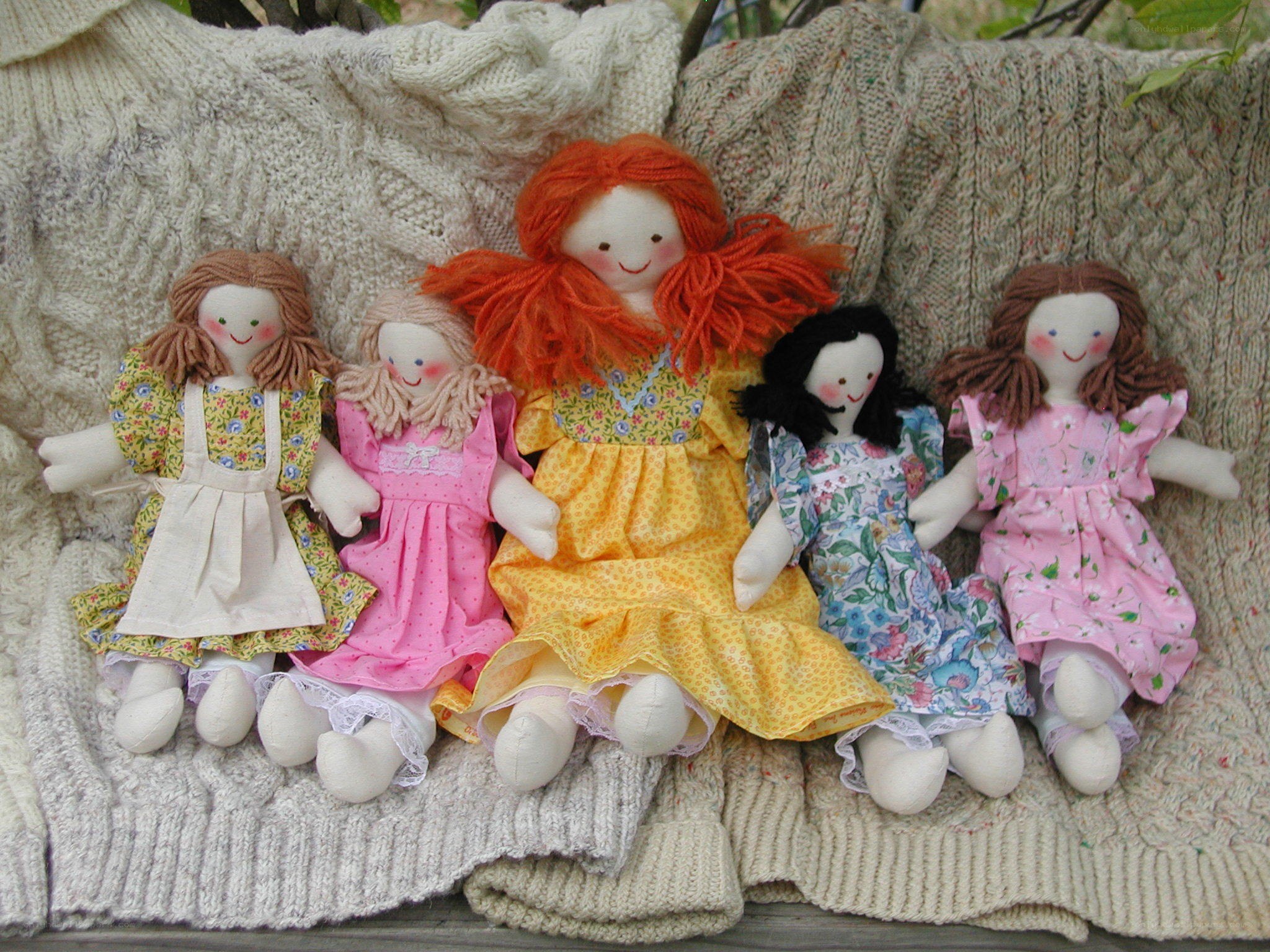 Handmade dolls on a blanket