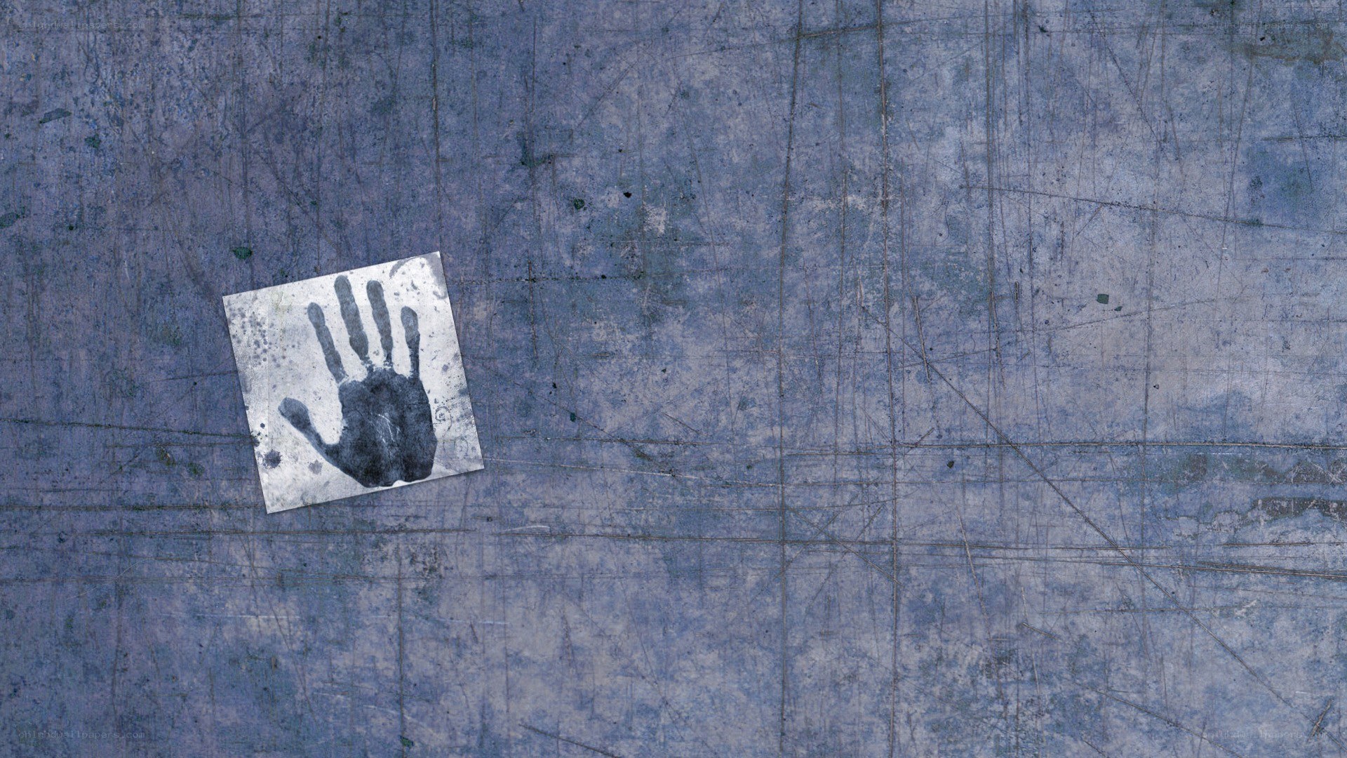 handprint on a metal surface