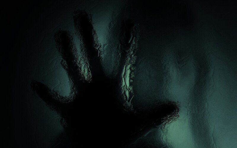 handprint on dark surface