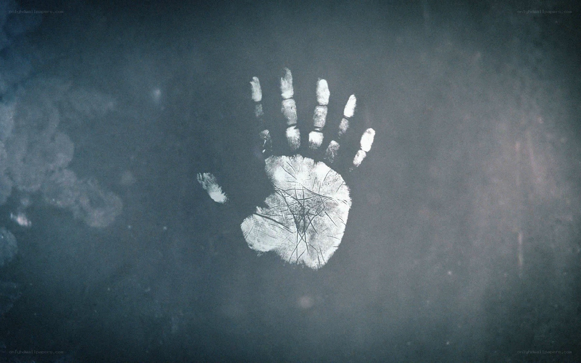 handprint on dark surface