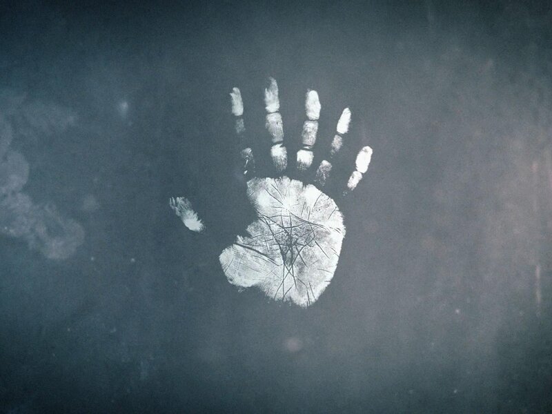 handprint on dark surface