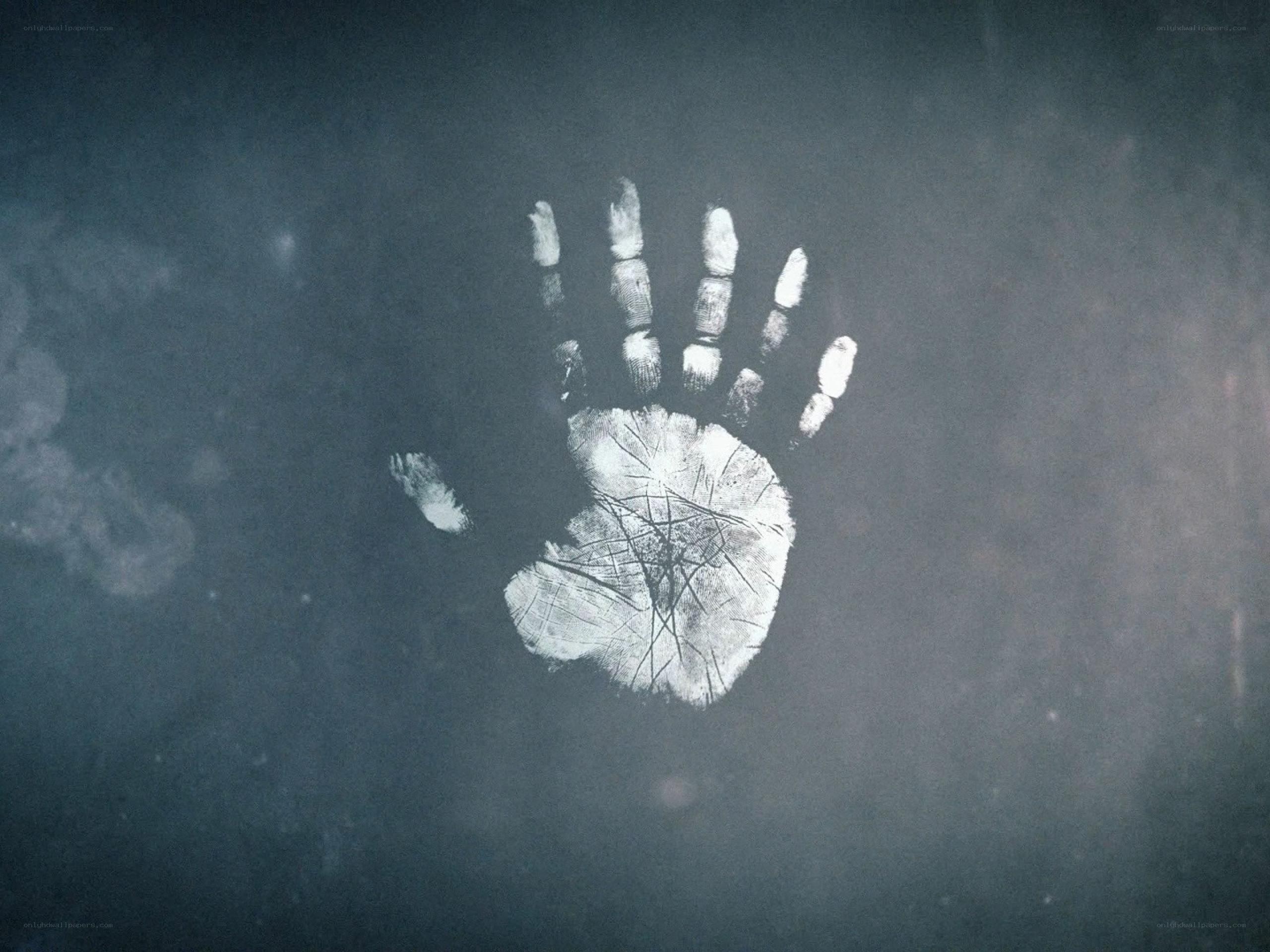 handprint on dark surface