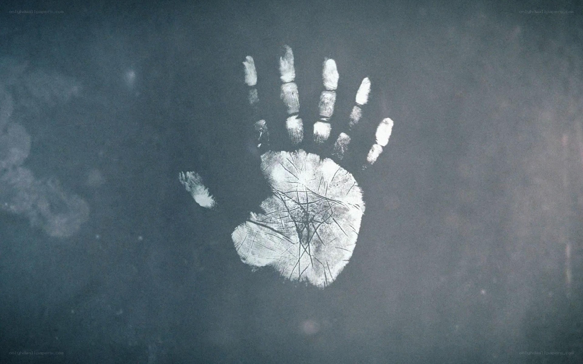 handprint on dark surface