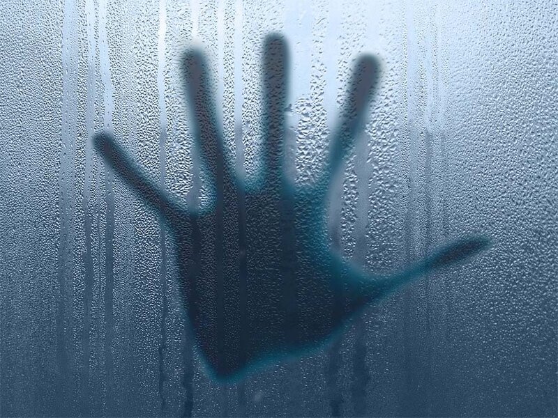 handprint on fogged glass