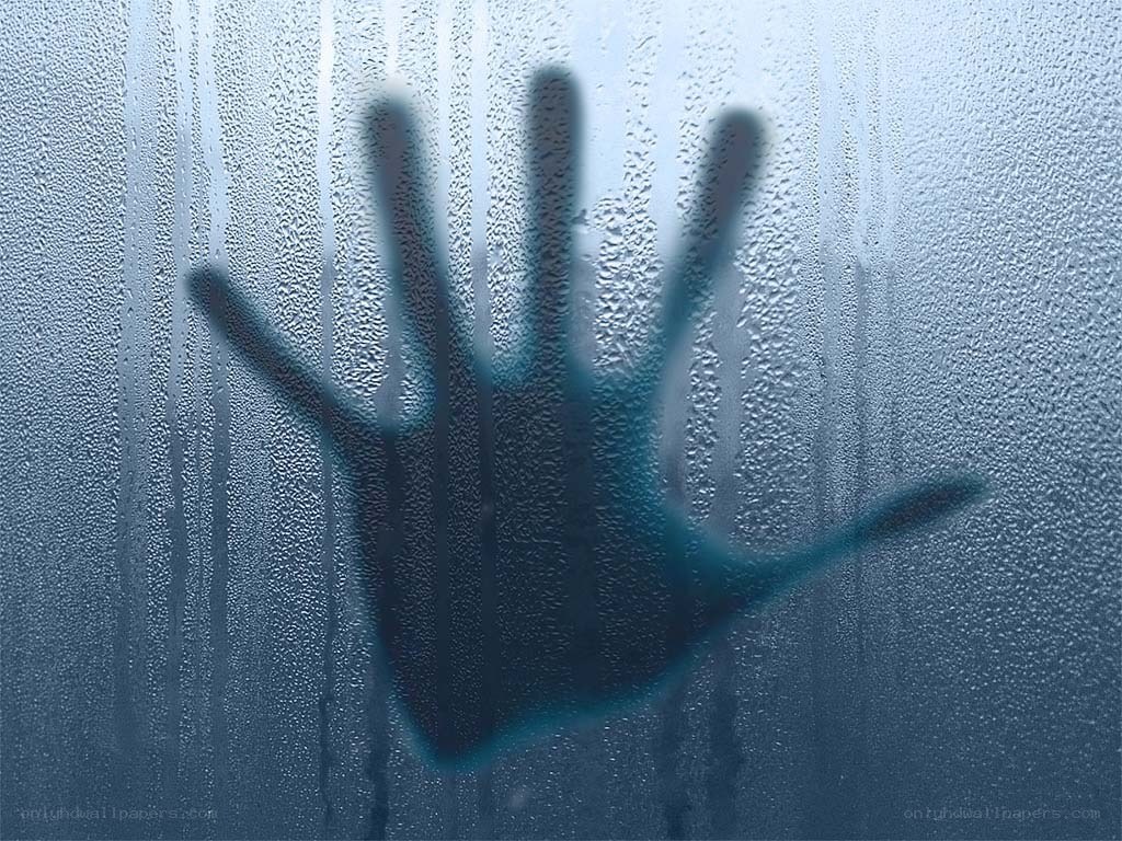handprint on fogged glass
