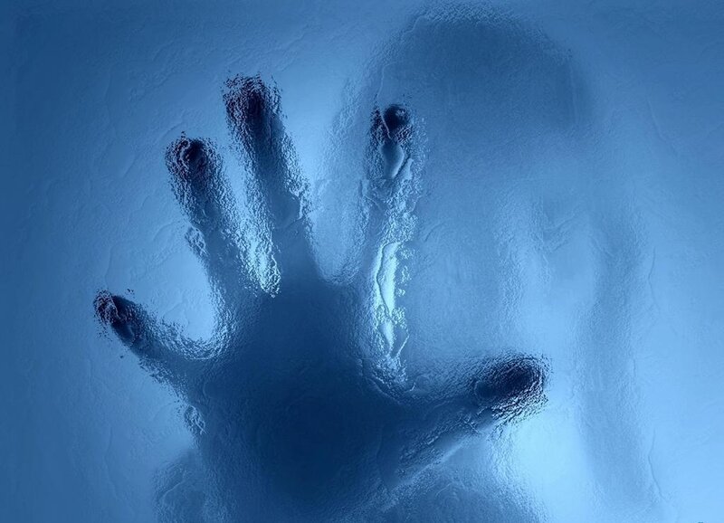 handprint on frosted glass