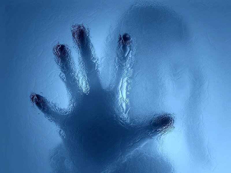 handprint on frosted glass