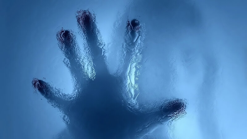 handprint on frosted glass