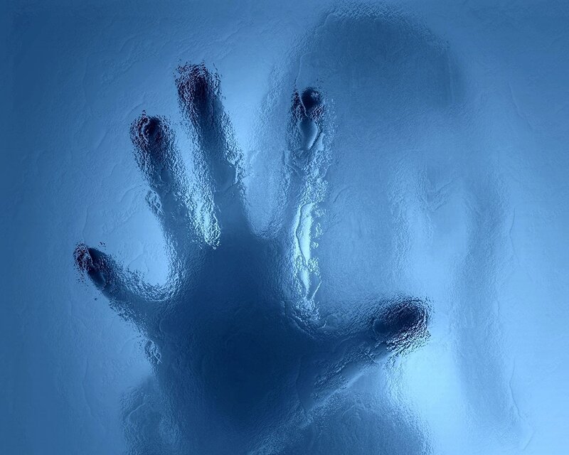 handprint on frosted glass