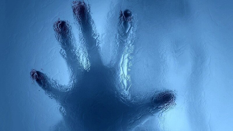 handprint on frosted glass