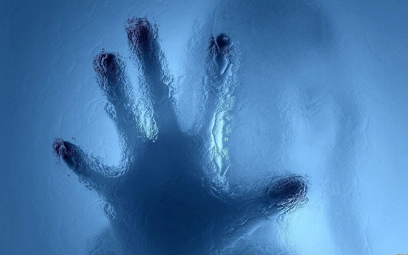 handprint on frosted glass