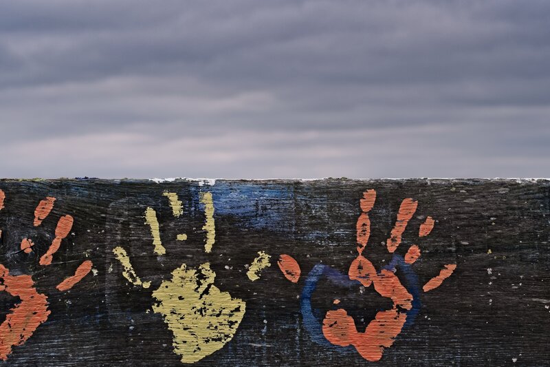 Handprints on Wooden Surface