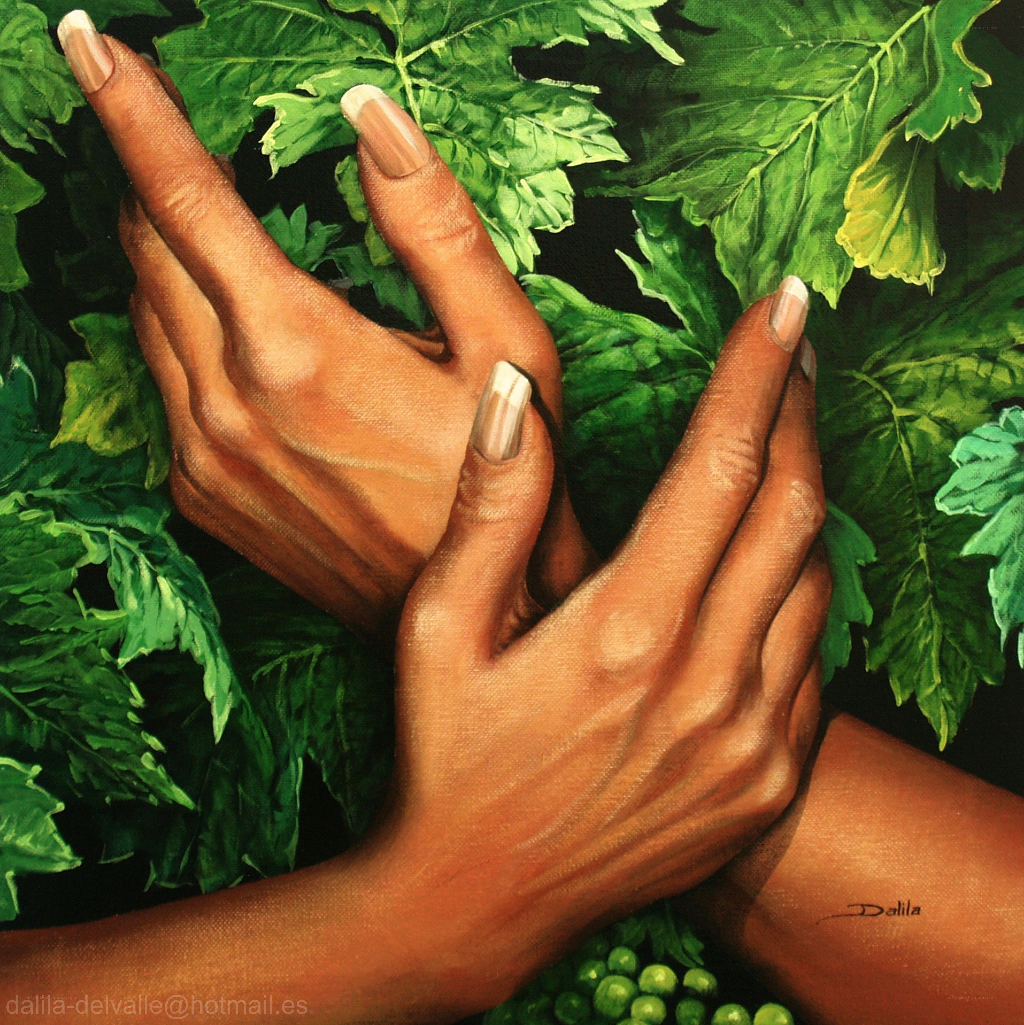 hands among green leaves