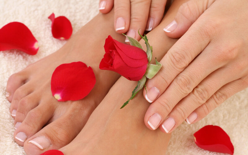 Hands and feet with rose petals