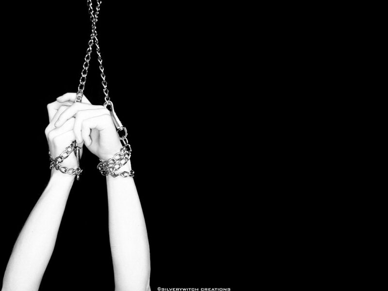 Hands bound by chains