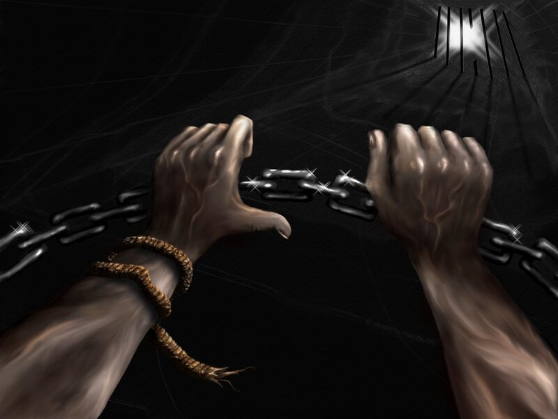 Hands breaking chains in prison