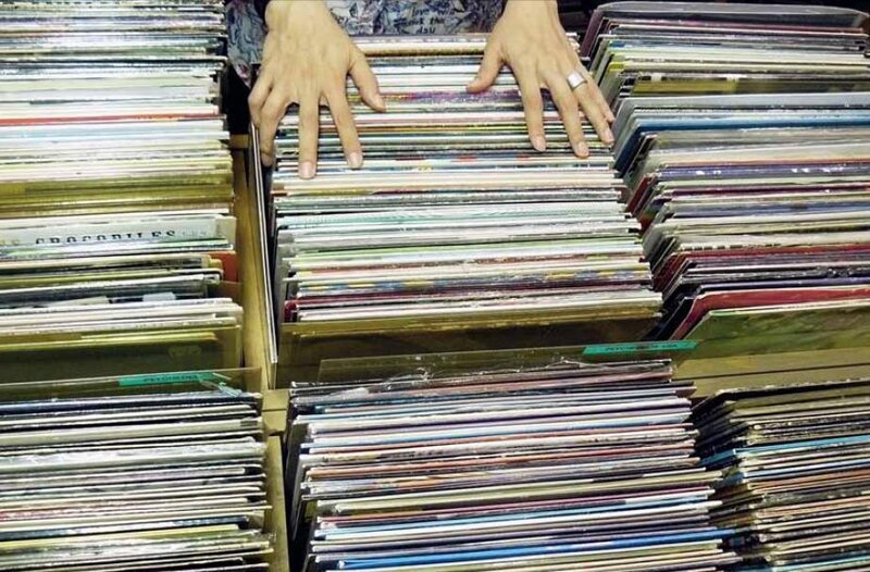 Hands browsing vinyl records