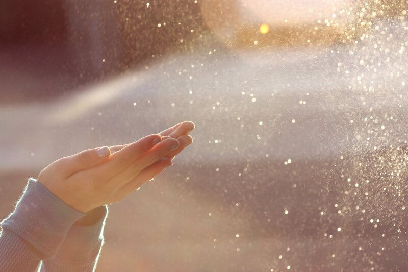 hands catching sunlight