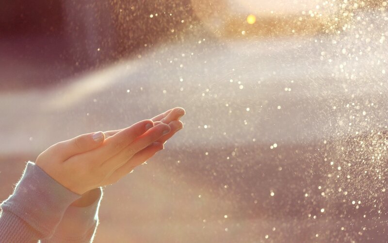 hands catching sunlight