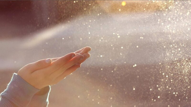 Hands Catching Water Spray