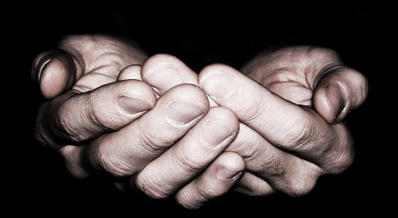 Hands clasped in prayer