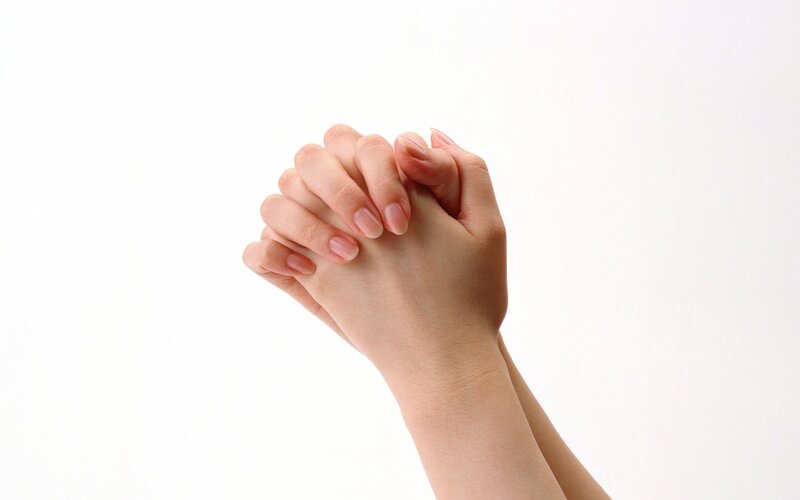 hands clasped in prayer