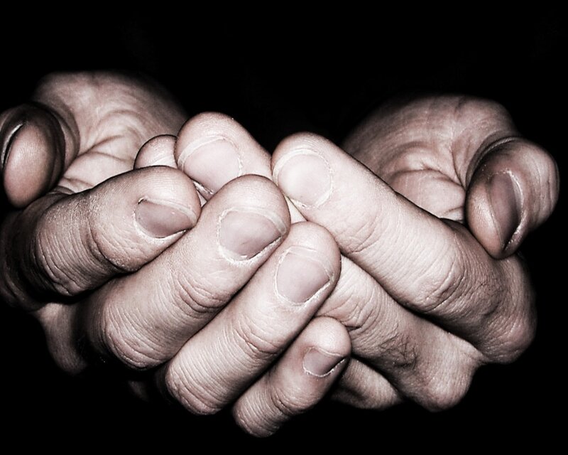 hands clasped in prayer