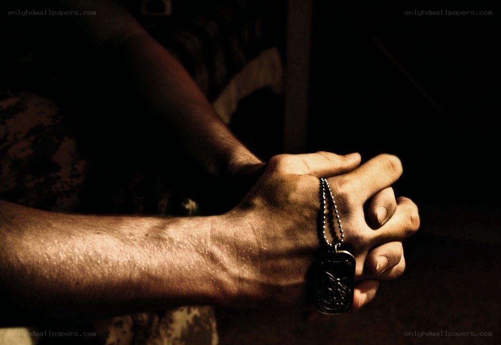 hands clasped in prayer