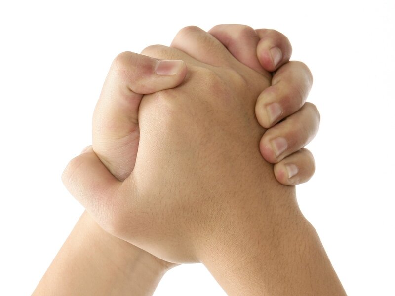 hands clasped in prayer