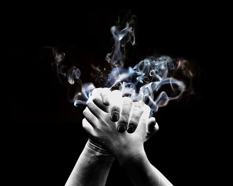 Hands Clasped in Smoke