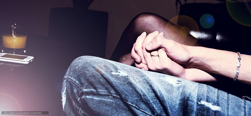 hands clasped on lap