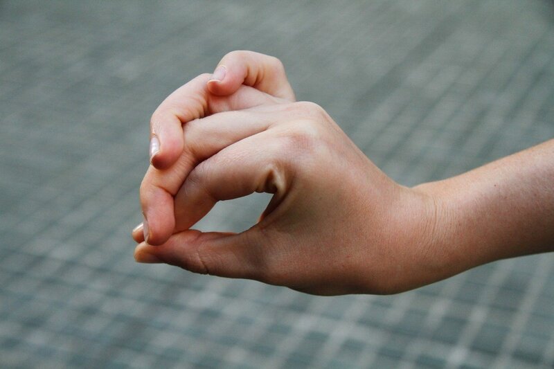 hands clasped together