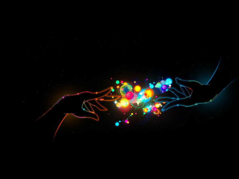 hands connecting with colorful energy