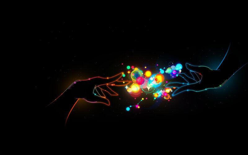 hands connecting with light