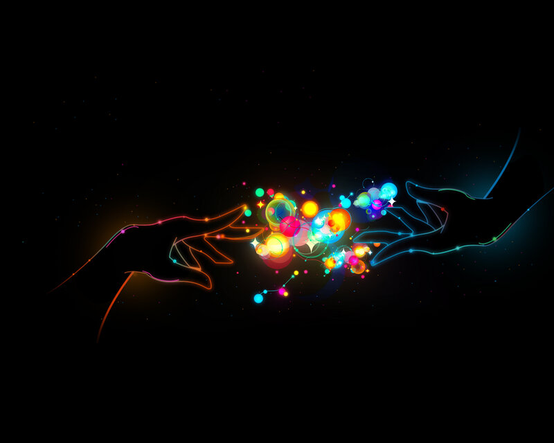 hands connecting with light