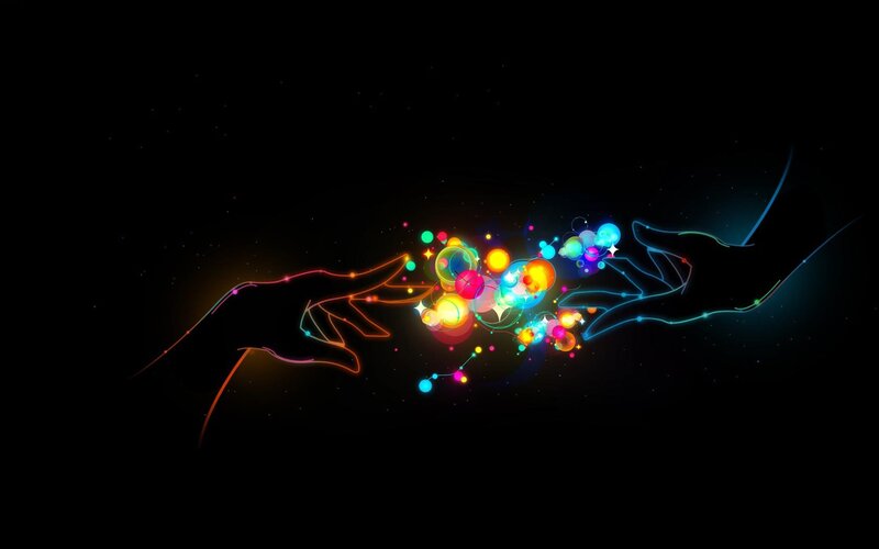 hands connecting with light