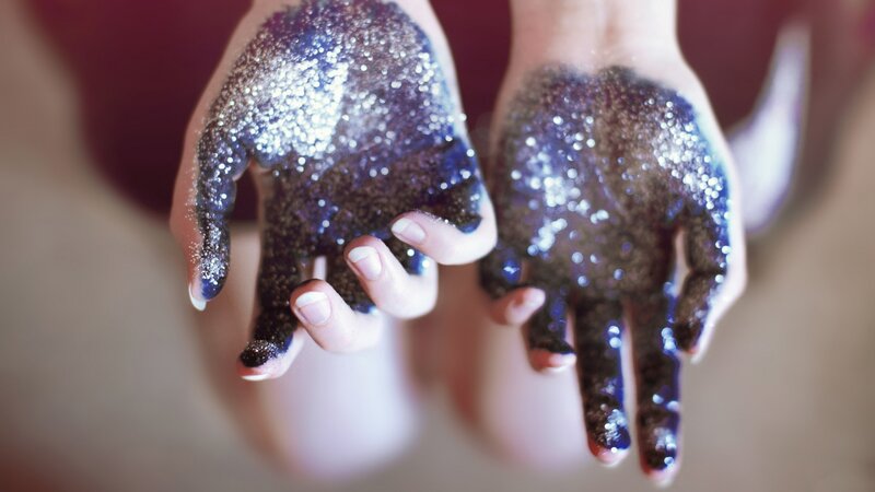 hands covered in glitter