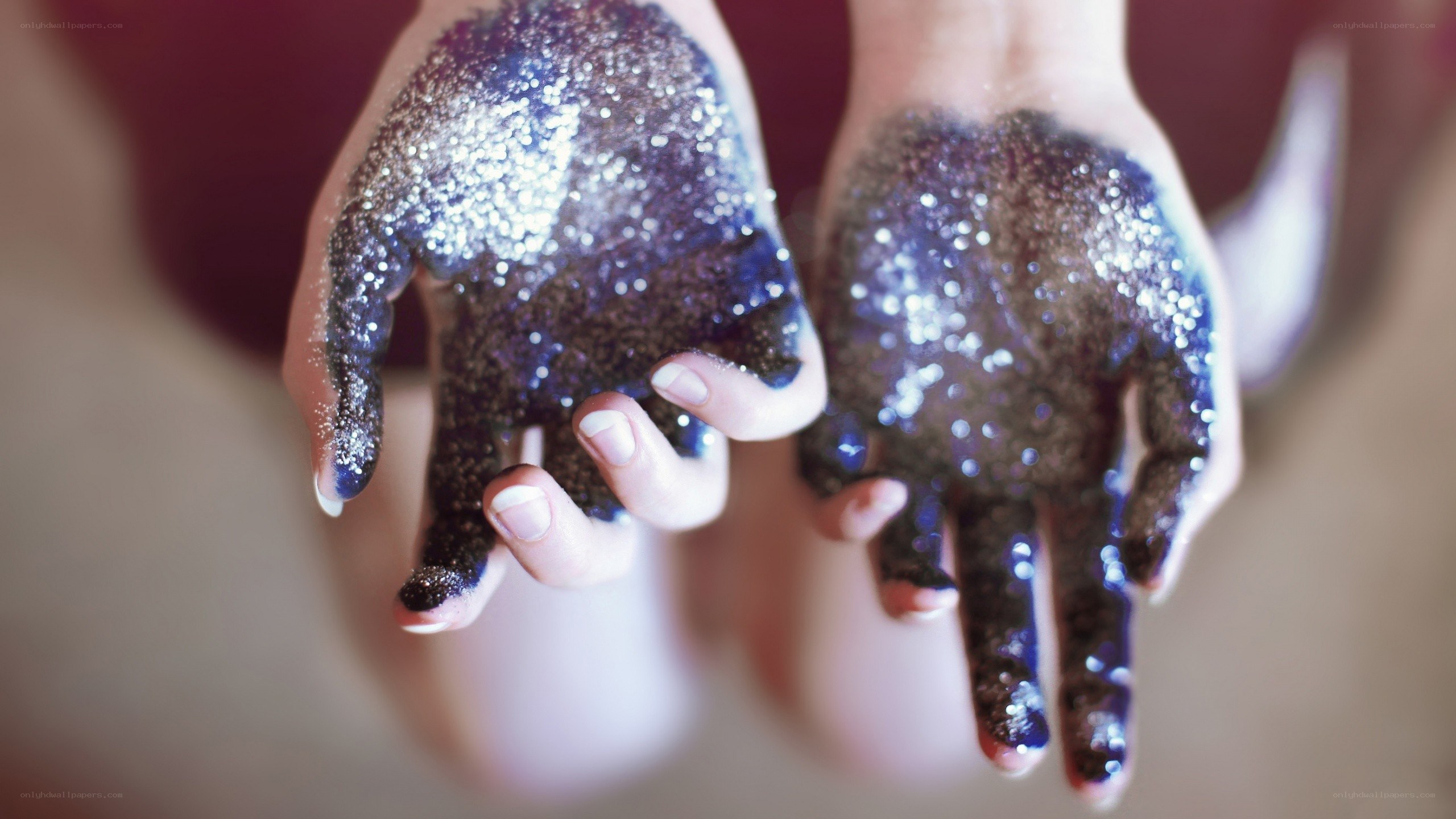 hands covered in glitter