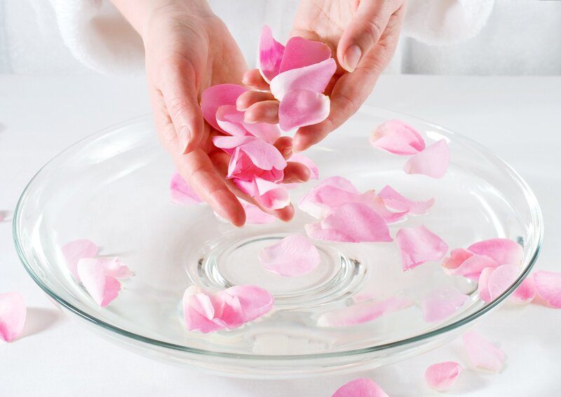 Hands Dropping Rose Petals