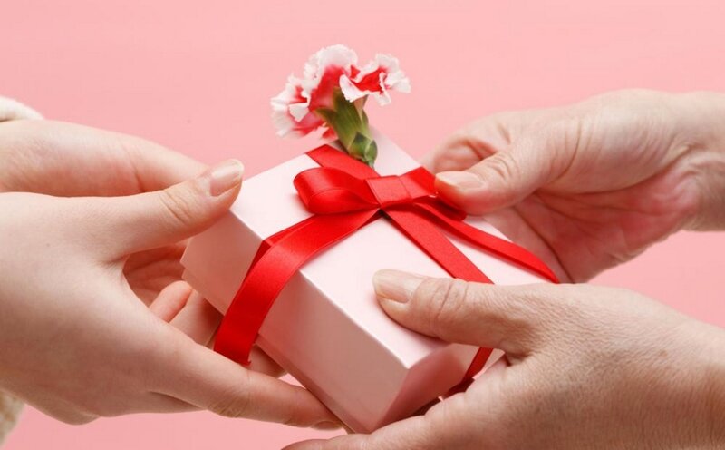 Hands Exchanging Gift Box
