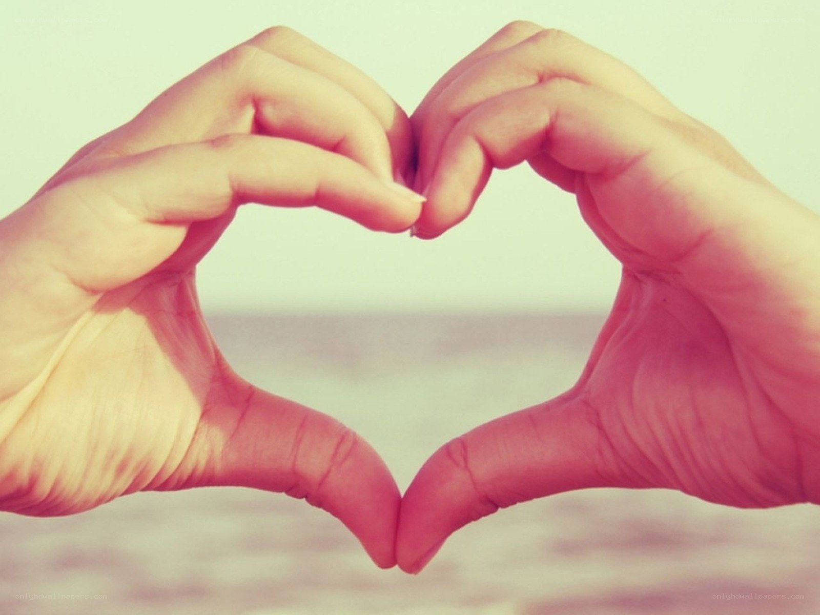 Hands forming a heart shape