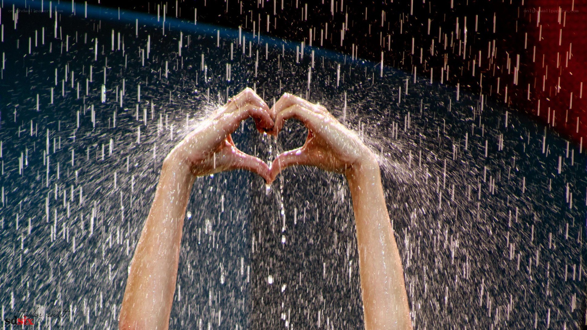 Hands forming heart in rain