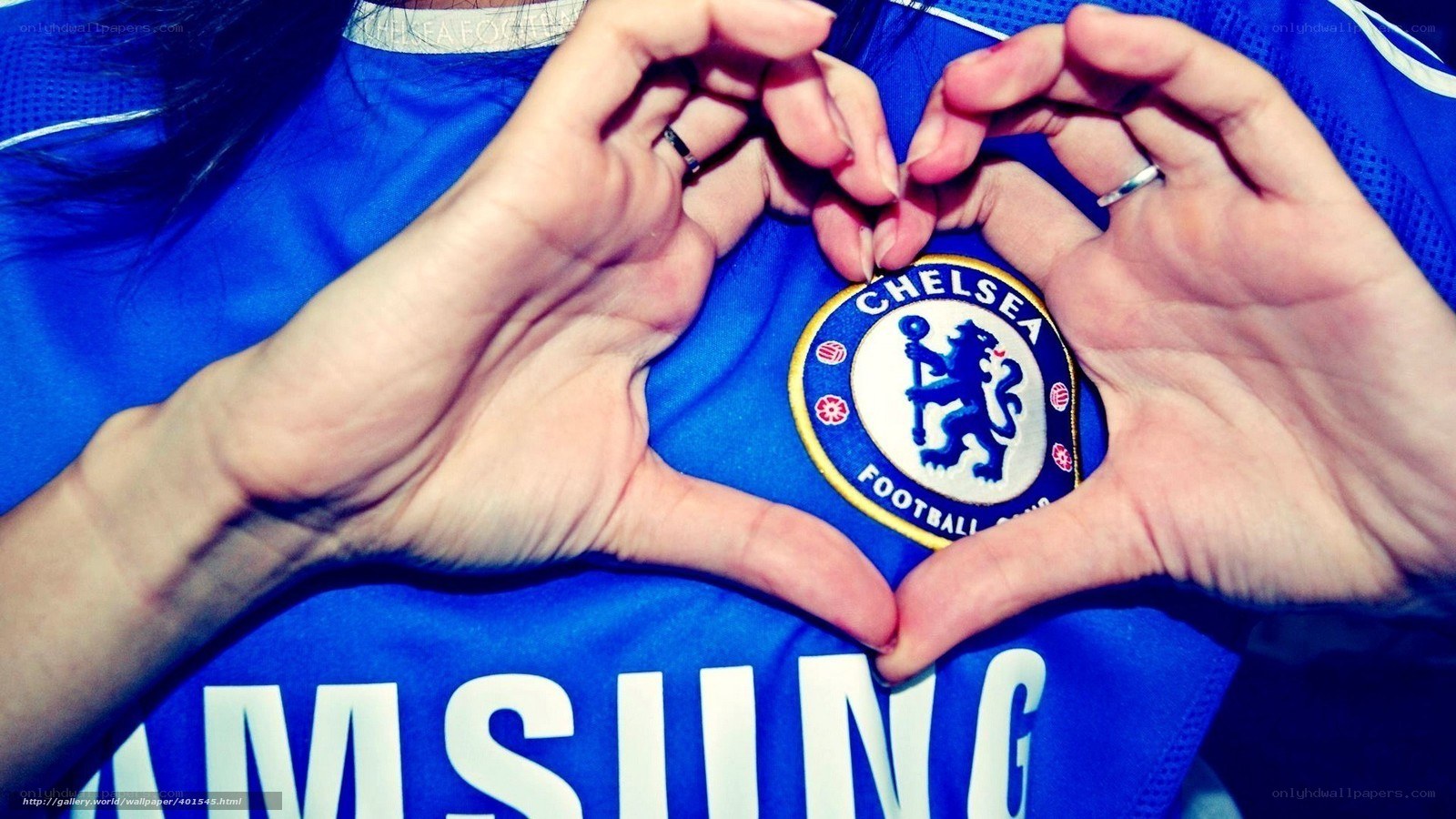 Hands forming heart over Chelsea badge