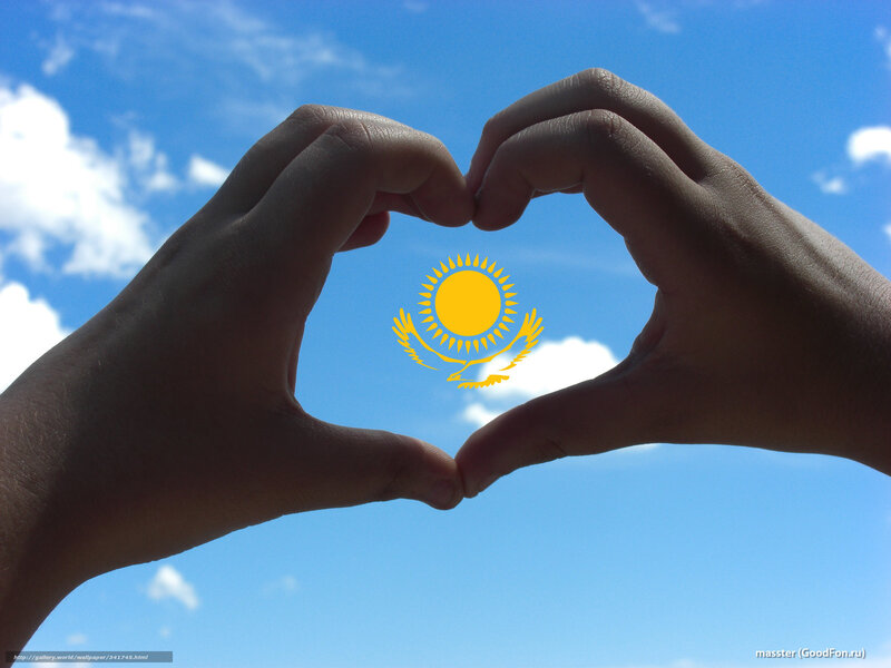 Hands forming heart with flag