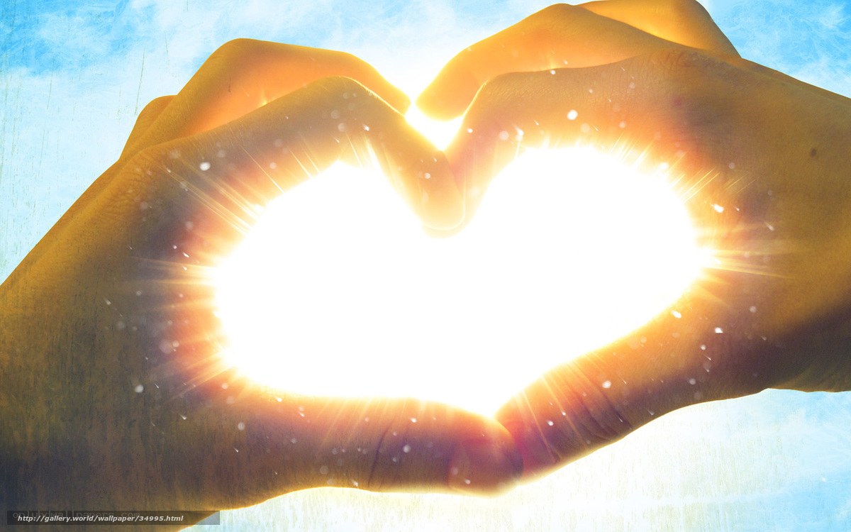 Hands forming heart with sun